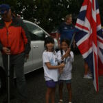 The two charming local girls who asked to carry our flag.